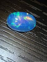Top view of oval opal showing play-of-color