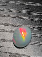 Front view of oval Ethiopian opal showing play-of-color