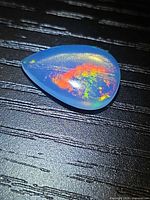 Pear-shaped jelly opal showing play-of-color