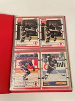 Page with two Wayne Gretzky cards, one Mark Messier card and one Gretzky Magician insert in red binder