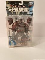 Front view of sealed Techno Spawn Code Red figure in blister