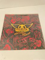 Front cover in shrink with artwork and logo visible