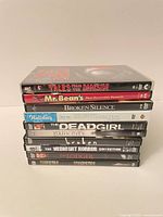 Stack of 10 DVD cases showing spine titles