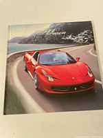 Front cover showing red Ferrari 458 Spider with title
