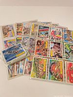 Spread of Dart Vietnam War trading cards in sleeves with loose stack