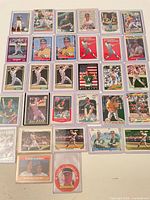 Grid view showing majority of the 30 sleeved baseball cards