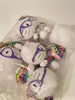 Sealed bag containing multiple Hello Kitty plush toys
