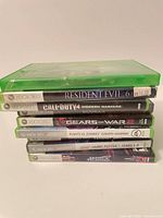 Stack of game cases showing spines and titles