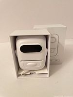 Front view of Marklife P50 label maker seated in box