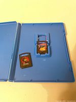 Open Sly Cooper case holding both cartridges
