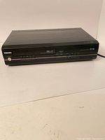 Front angled view of Toshiba D-VR7 unit showing overall condition and both media slots