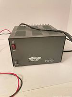 Front view of Tripp Lite PR-60 showing branding, ON/OFF switch and control knob