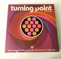 Top of box showing Turning Point title and swirl design