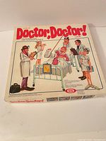 Front view of Doctor, Doctor! box showing title, artwork and Ideal logo