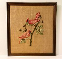 Full view of framed needlepoint art