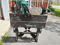 Front view of Black & Decker Workmate 225 with spring clamps inserted in top