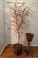 Full view of the 6ft artificial cherry blossom tree in its wooden planter