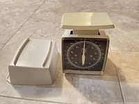 Scale front view with cover beside it