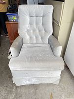 Front view of grey rocking armchair