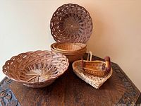 All five rattan/wicker baskets displayed on table