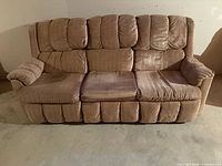 Front view of tan three-seat sofa