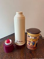 Thermos with cap removed and matching coffee canister