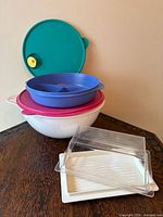 Group shot of Tupperware bowl, plate with lid, and cheese keeper
