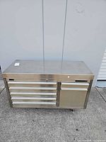 Front view showing full tool chest with drawers and cabinet door