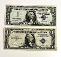 Obverse of both silver certificates displaying blue seals and serial numbers