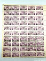 Front of sheet showing 60 purple Oregon commemorative stamps with left and right selvage
