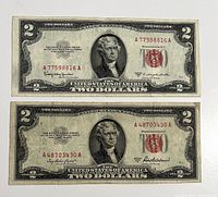 Front view of both red seal notes showing serial numbers, seals, signatures