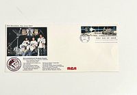 Front of first day cover showing stamps, cancellation, Apollo 15 crew photo, RCA text and logo