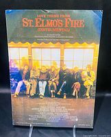 Front cover of St. Elmo's Fire sheet music showing cast photo and title