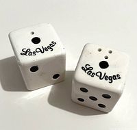 Top view of both dice shakers showing Las Vegas script and fill holes