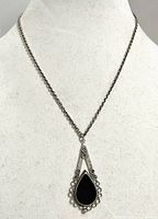 Necklace on bust showing pendant detail