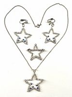 full set laid out: necklace, earrings, brooch