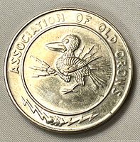 Obverse showing crow with lightning bolts and organization name