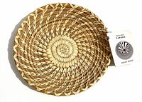 Front view showing coiled weave and attached tag