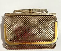Front view of goldtone mesh wallet showing metal frame and clasp