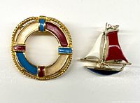 Front view of both brooches showing design and color