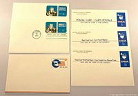 Five prepaid postal cards arranged showing fronts including America’s Hospitals, blue USA map cards, Visit the USA