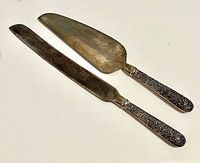 Knife and server front view showing shape and tarnish