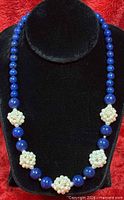 Full necklace on display bust showing bead pattern