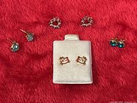 Full group shot showing all four earring pairs