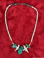 Full view of necklace laid flat showing bead composition