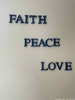 Blue wall letters forming words FAITH, PEACE, LOVE