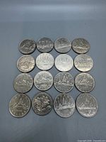 Front view of all 16 coins in 4×4 grid