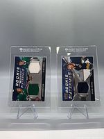Front view of both Rookie Materials cards in holders