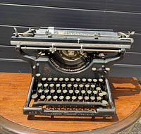 Front angled view of the Underwood Standard No. 3 showing keyboard, typebars, carriage and decals