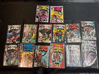 All fourteen bagged Conan the King comics laid out